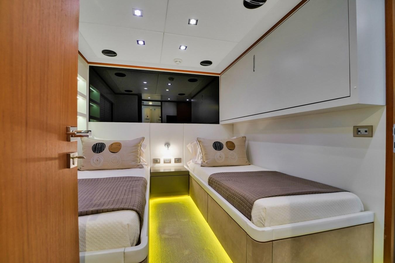 a room with beds and a window aboard DIAMOND Yacht for Sale