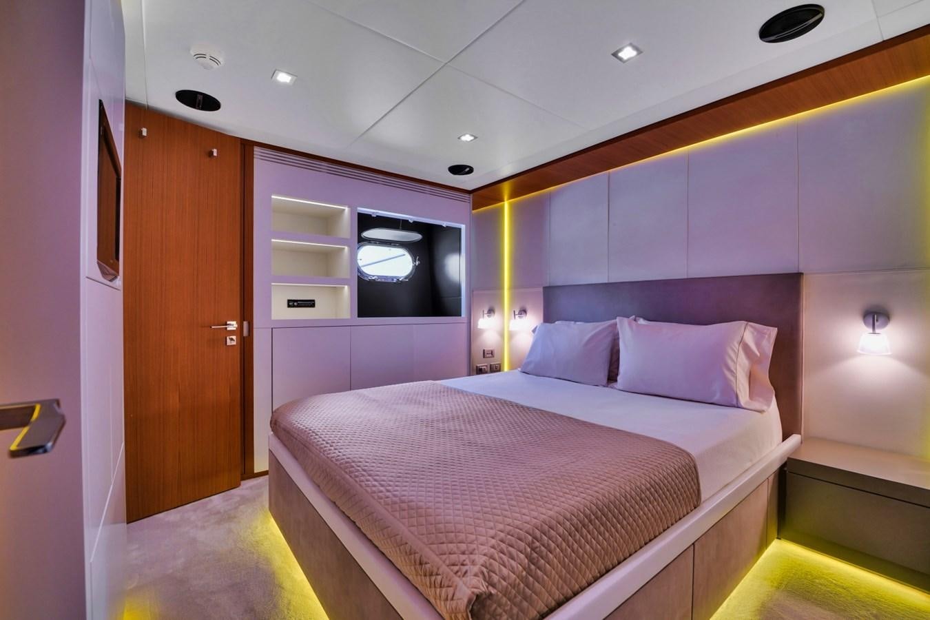 a bedroom with a bed and a closet aboard DIAMOND Yacht for Sale