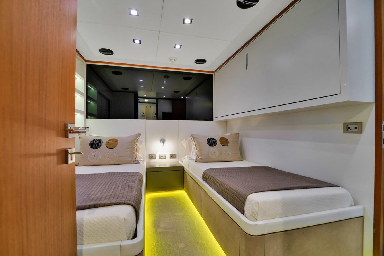 a room with beds and a window aboard DIAMOND Yacht for Sale