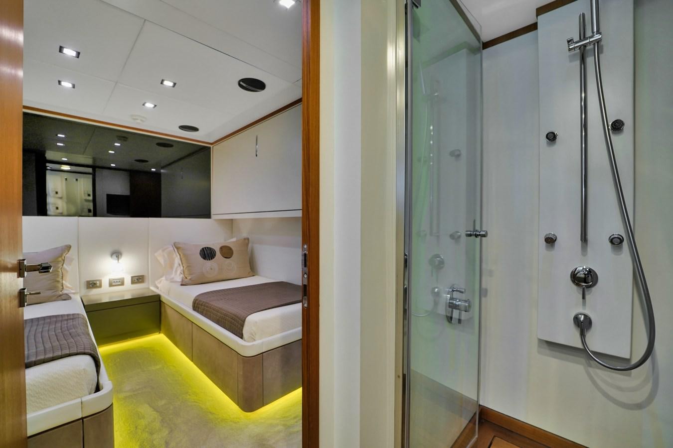 a room with a bed and a mirror aboard DIAMOND Yacht for Sale
