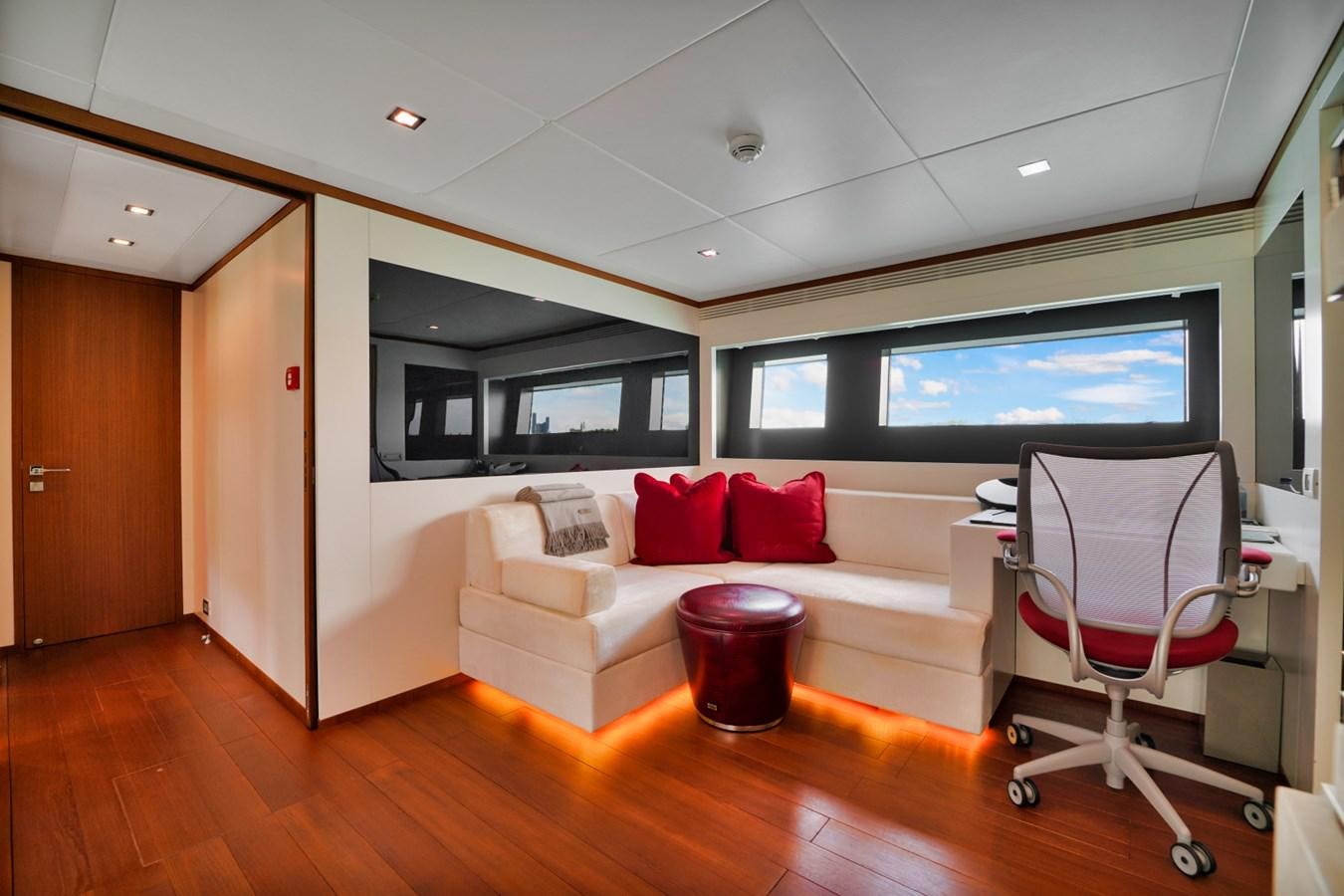 a room with a couch and a chair and a television aboard DIAMOND Yacht for Sale