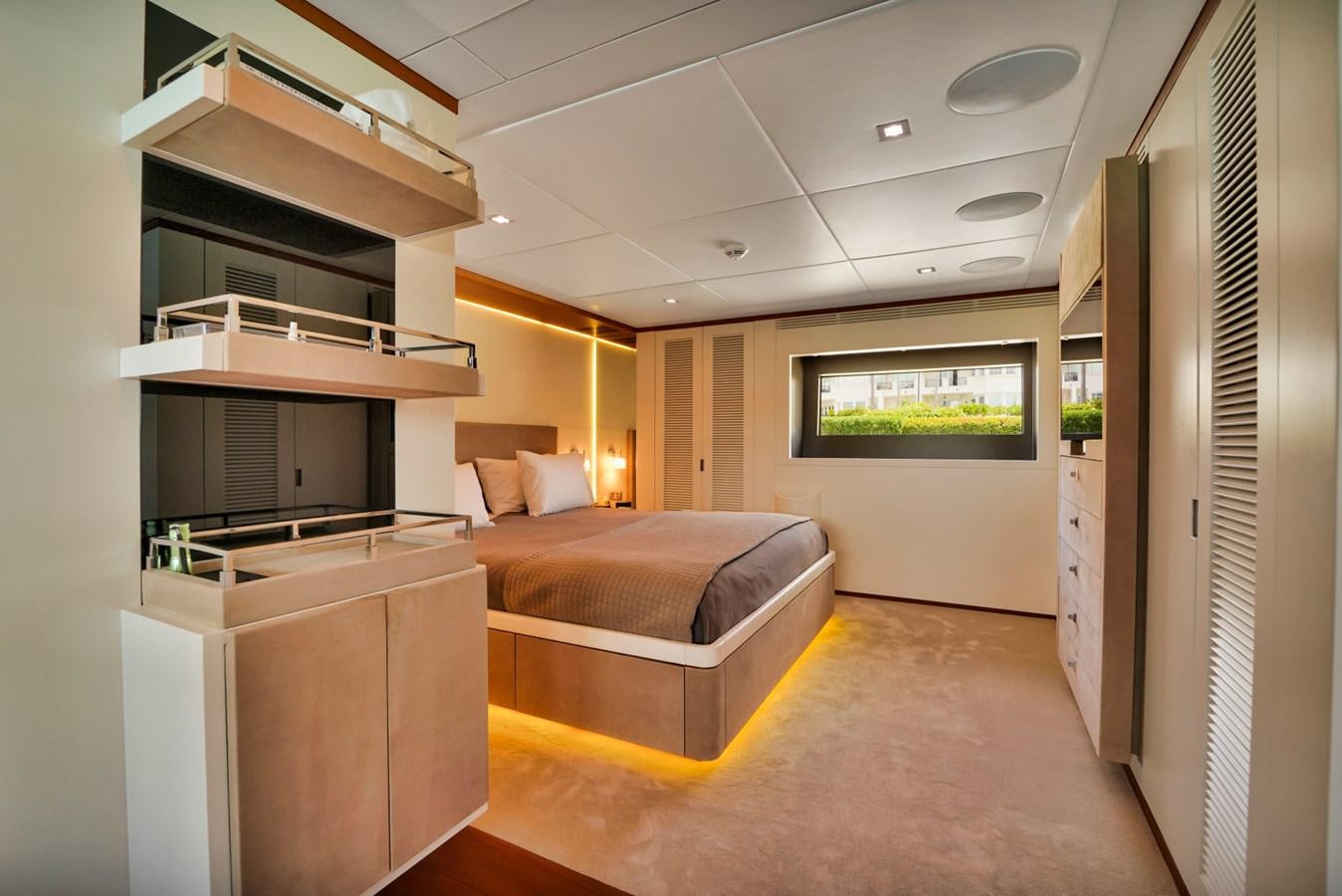 a bedroom with a bed and a tv aboard DIAMOND Yacht for Sale
