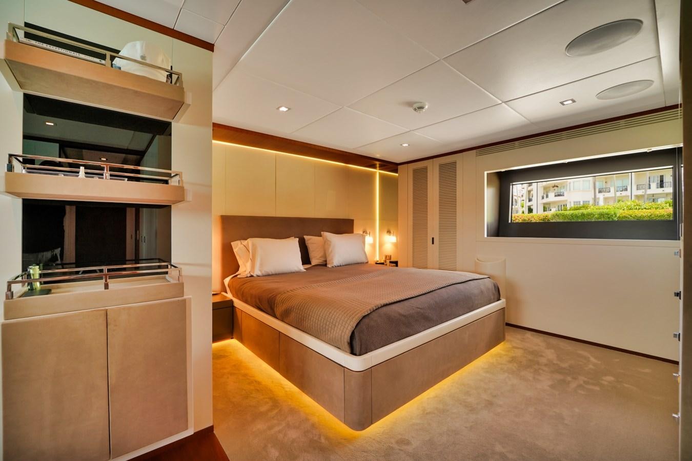 a room with a bed and a tv aboard DIAMOND Yacht for Sale