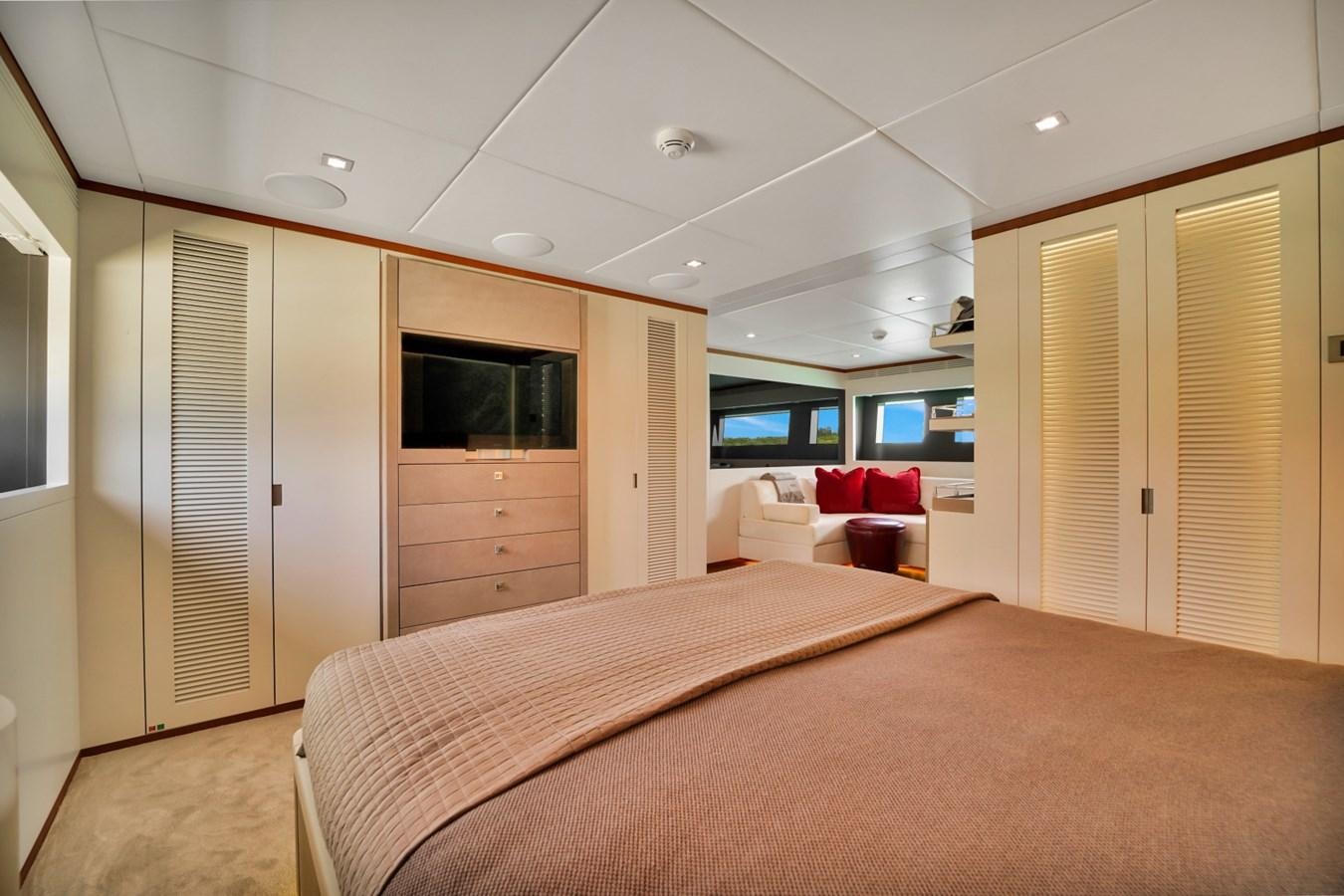 a bedroom with a bed and a desk aboard DIAMOND Yacht for Sale