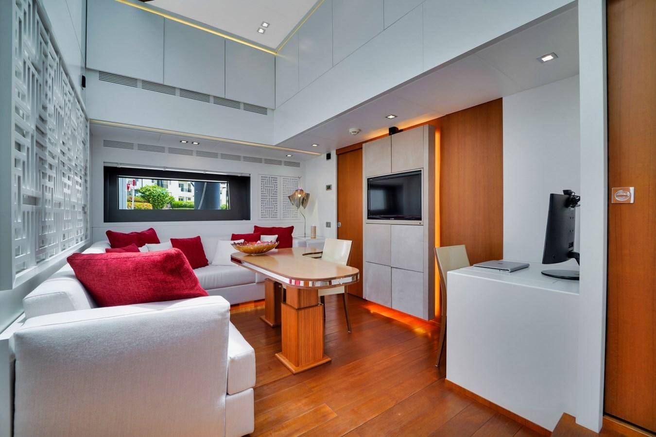 a living room with a white couch and a table aboard DIAMOND Yacht for Sale