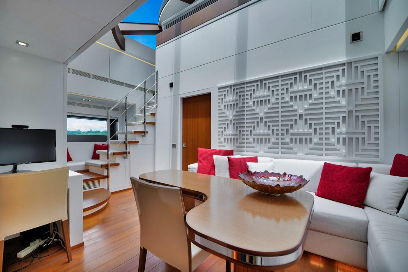 a living room with a couch and a table aboard DIAMOND Yacht for Sale