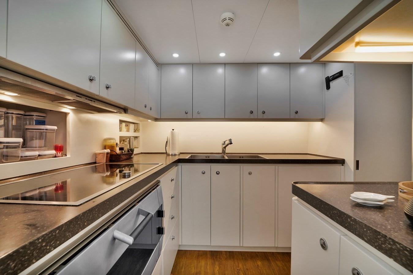 a kitchen with white cabinets aboard DIAMOND Yacht for Sale