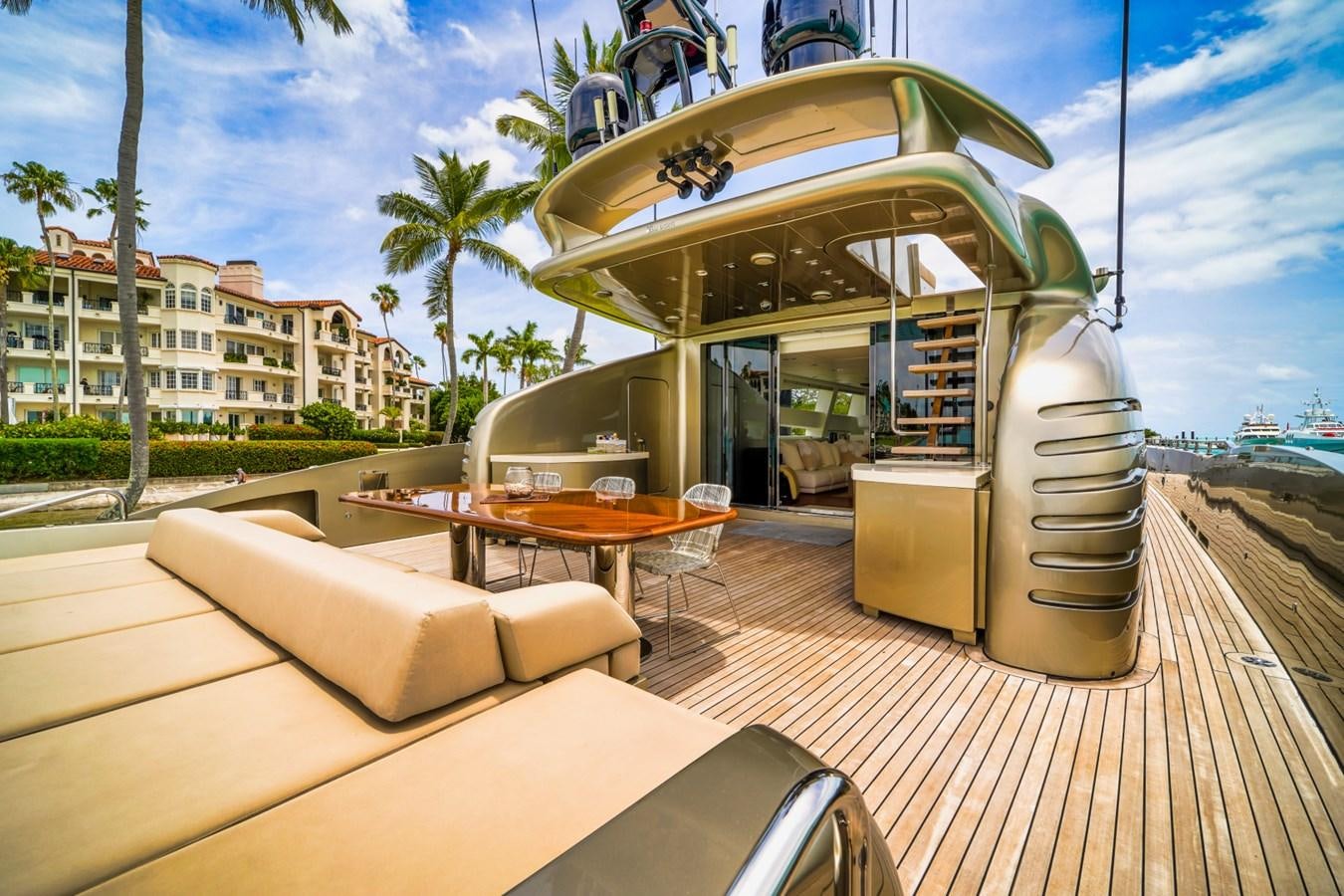 a deck with a table and chairs aboard DIAMOND Yacht for Sale