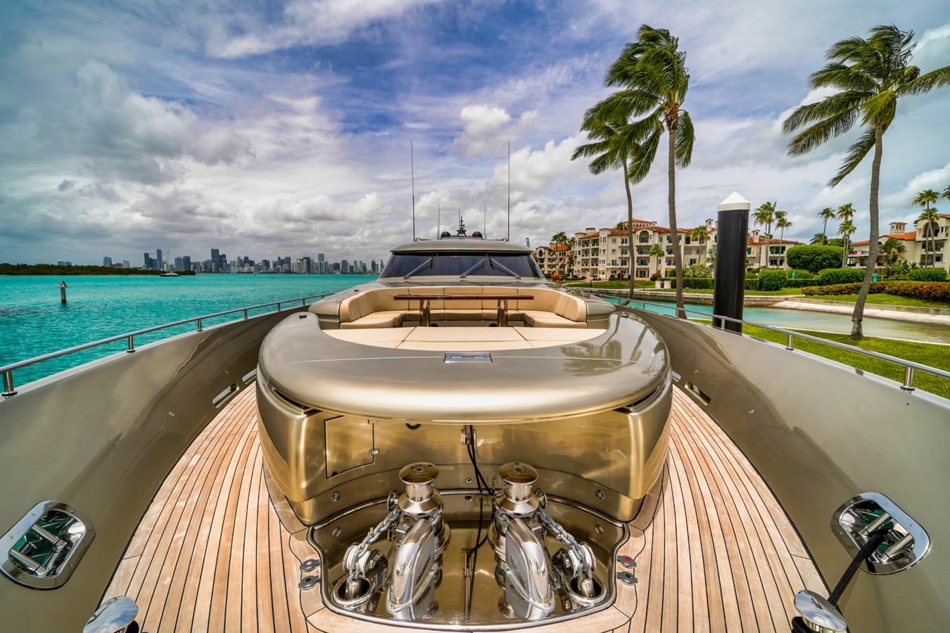 a deck with a grill and trees and a body of water in the background aboard DIAMOND Yacht for Sale