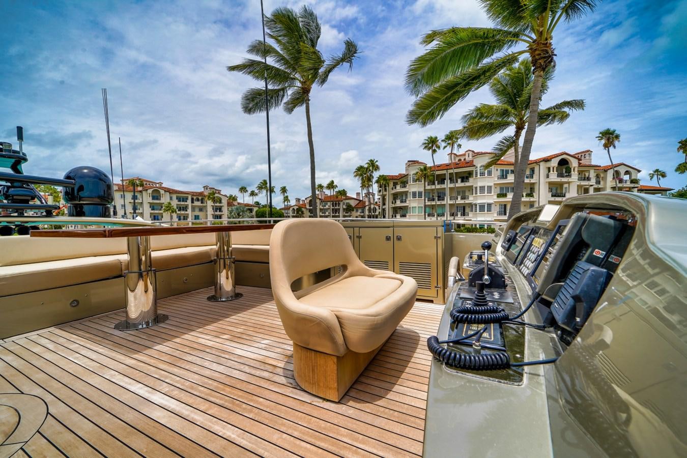 a deck with a chair and a pool and trees aboard DIAMOND Yacht for Sale