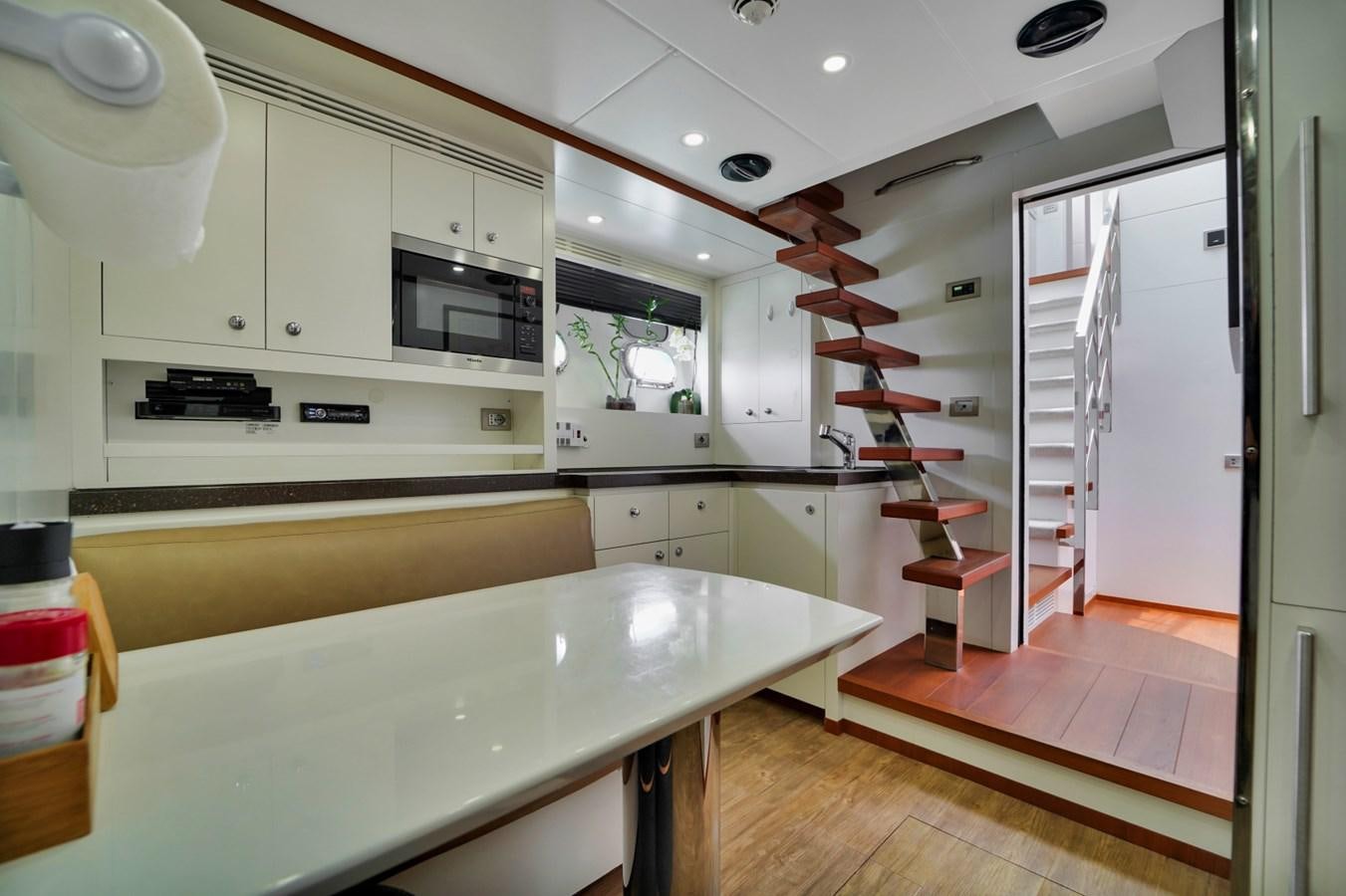 a kitchen with white cabinets aboard DIAMOND Yacht for Sale