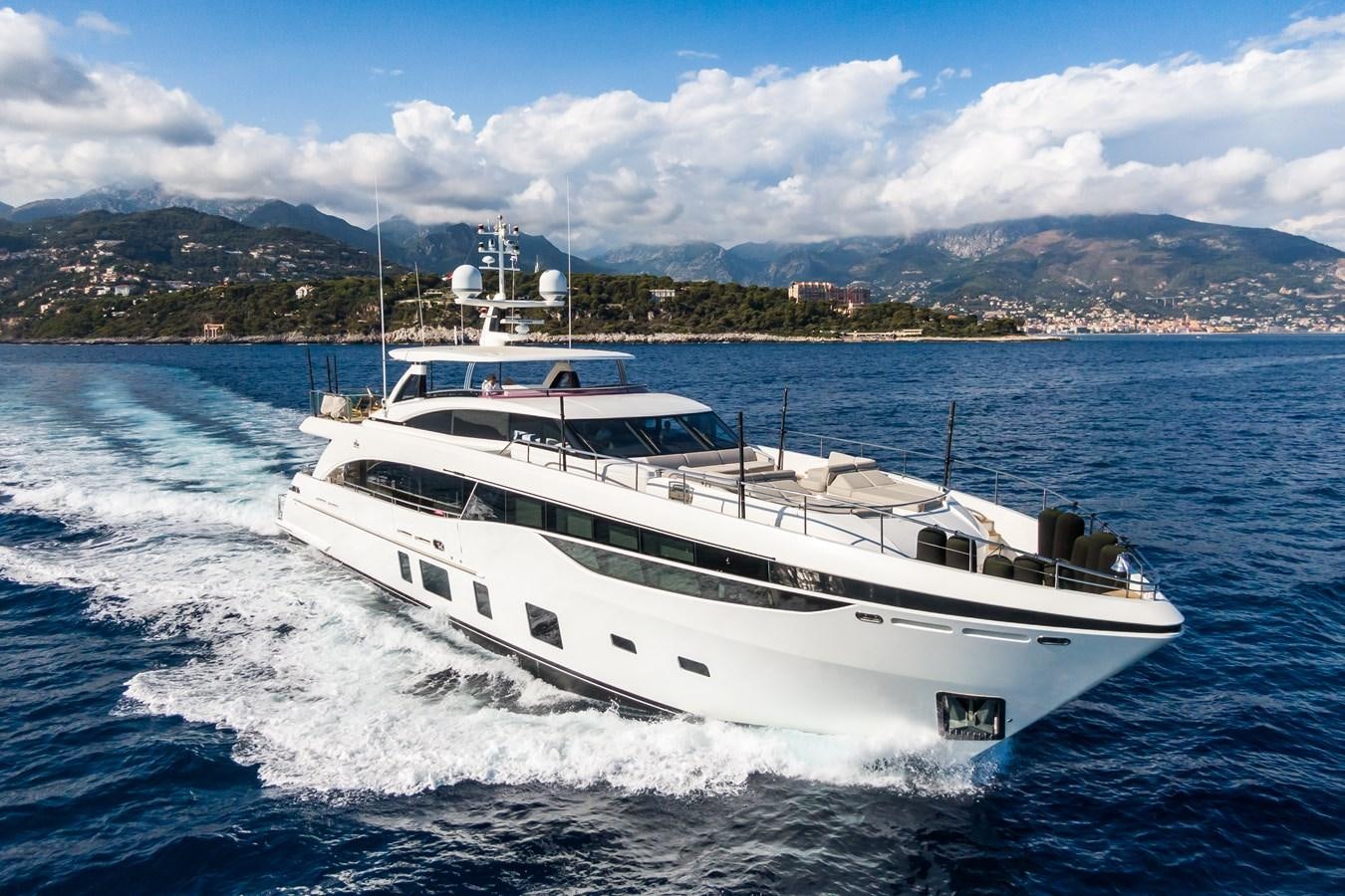 a white boat on the water aboard MINOR FAMILY AFFAIR Yacht for Sale