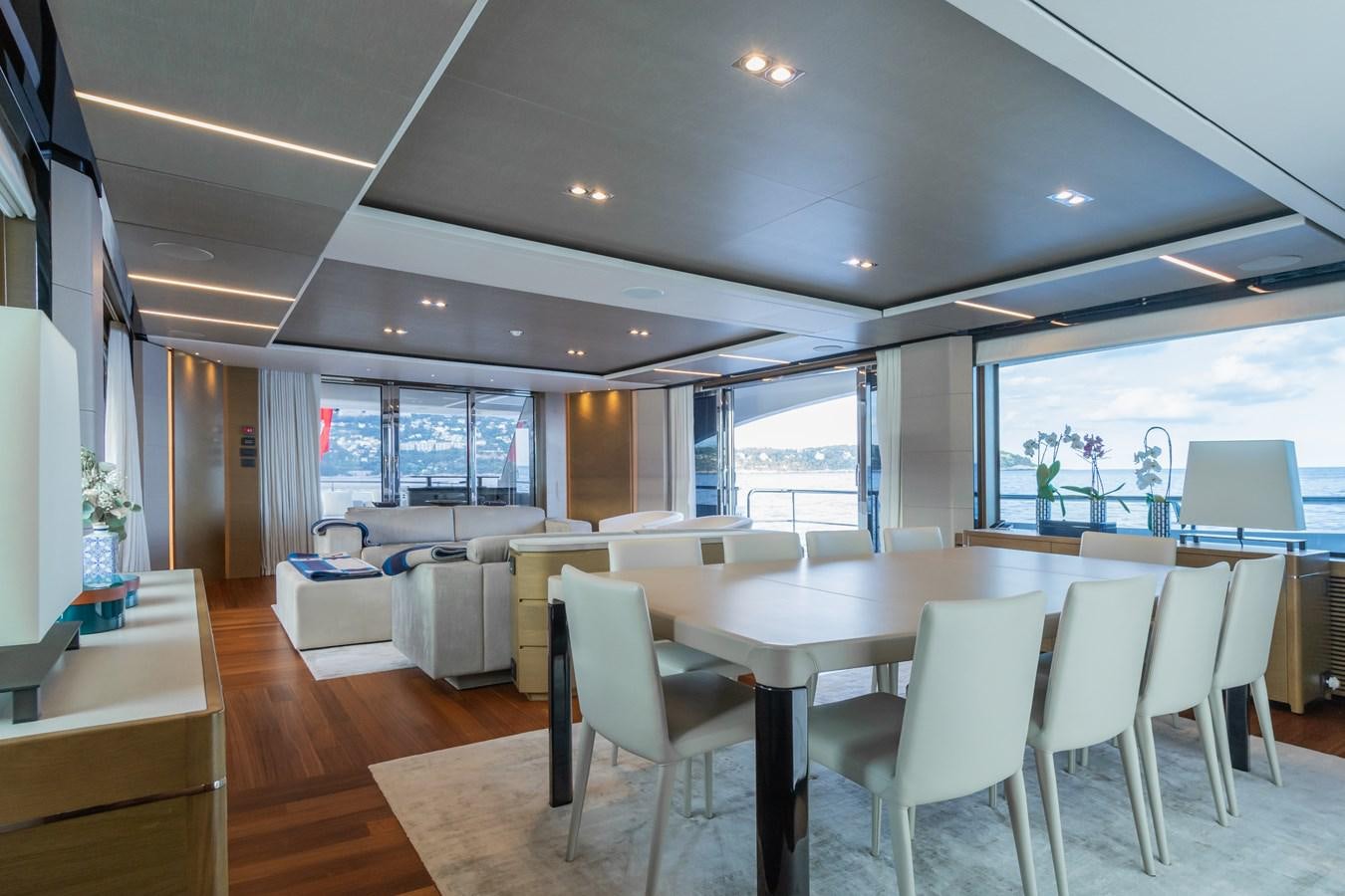 a room with tables and chairs aboard MINOR FAMILY AFFAIR Yacht for Sale