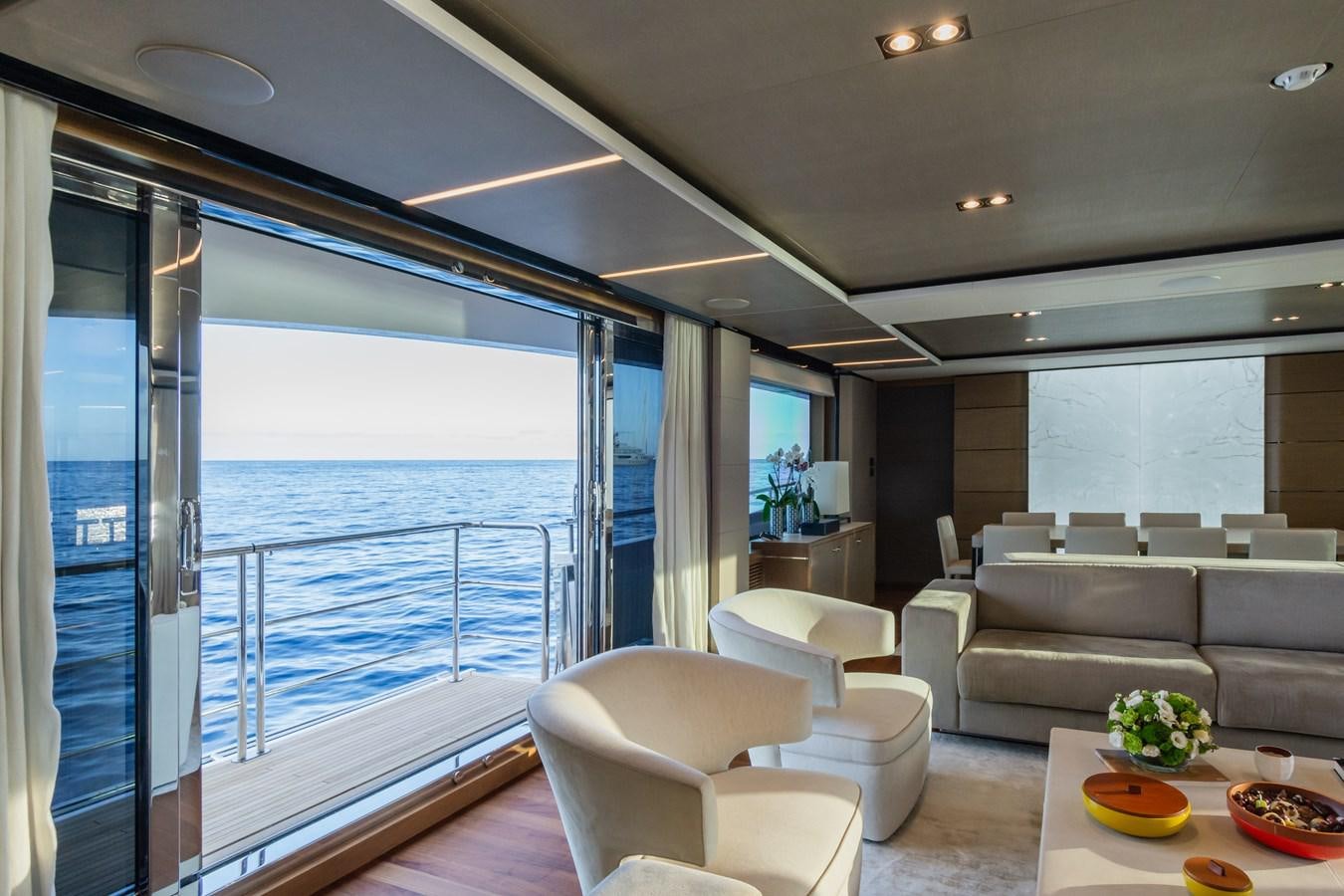 a living room with a large balcony aboard MINOR FAMILY AFFAIR Yacht for Sale