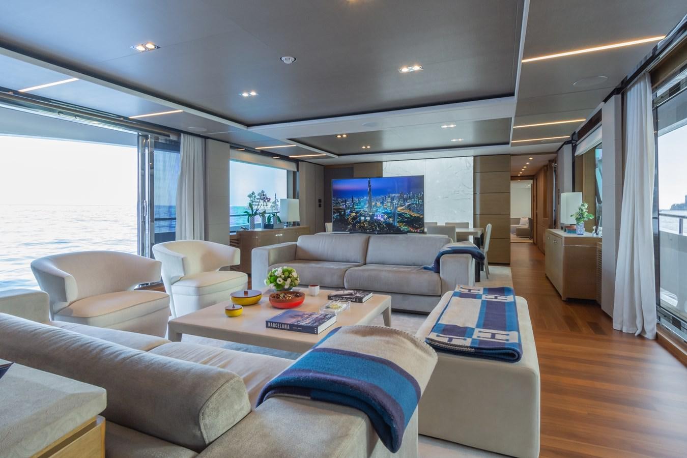 a living room with a large window aboard MINOR FAMILY AFFAIR Yacht for Sale