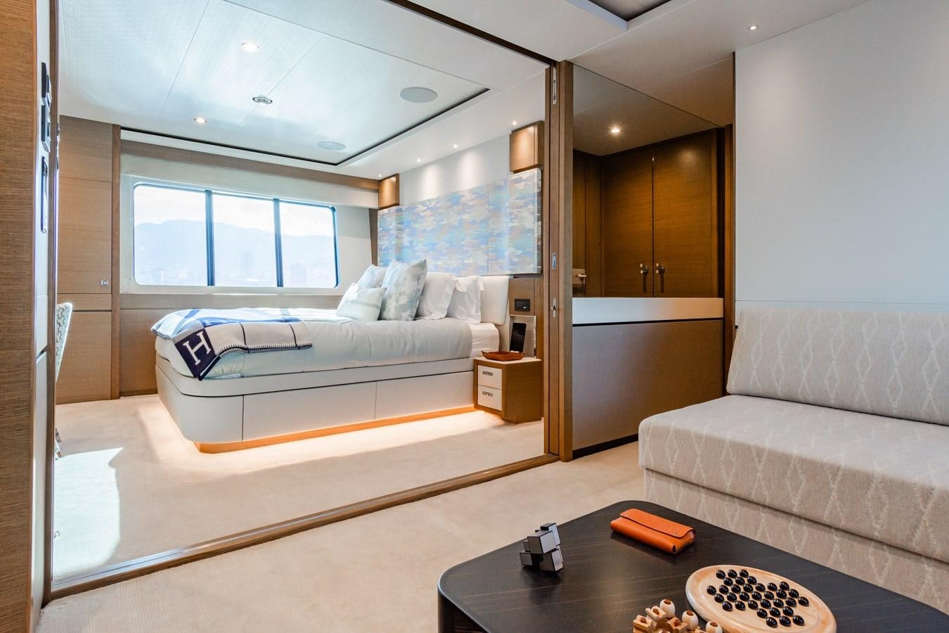 a living room with a couch and a coffee table aboard MINOR FAMILY AFFAIR Yacht for Sale