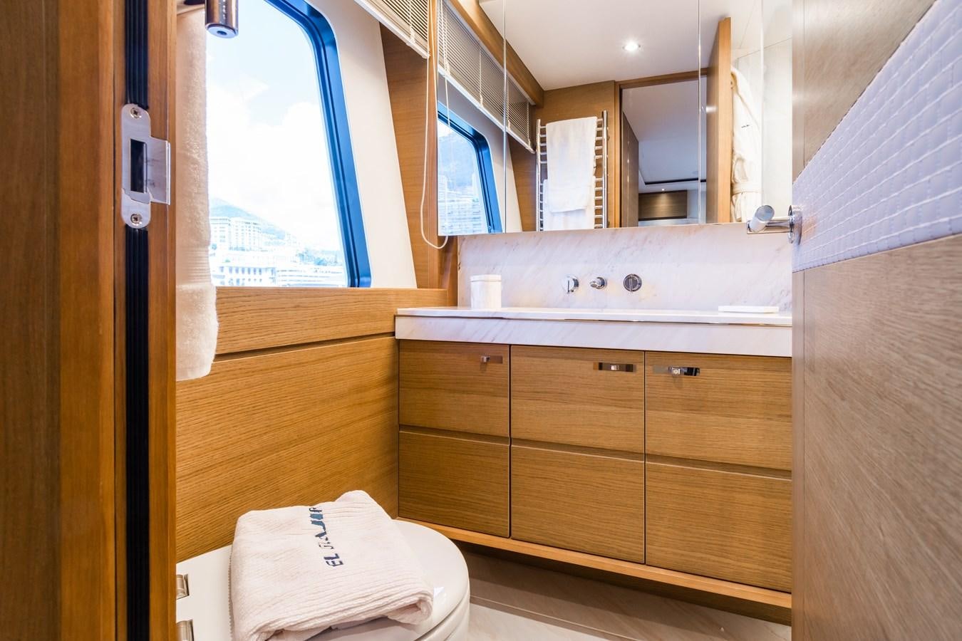a bathroom with a sink and cabinets aboard MINOR FAMILY AFFAIR Yacht for Sale