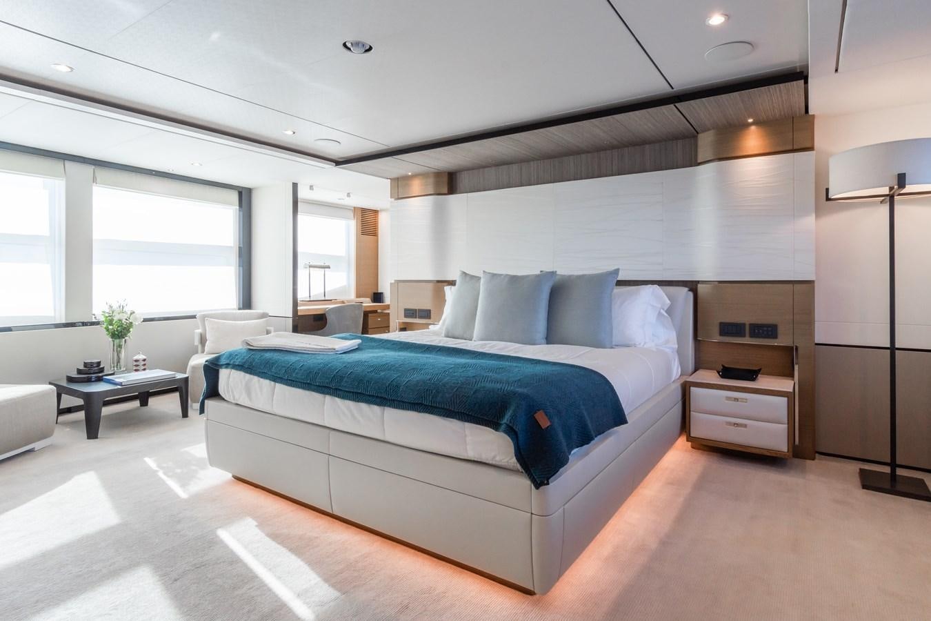 a bedroom with a bed and a desk aboard MINOR FAMILY AFFAIR Yacht for Sale