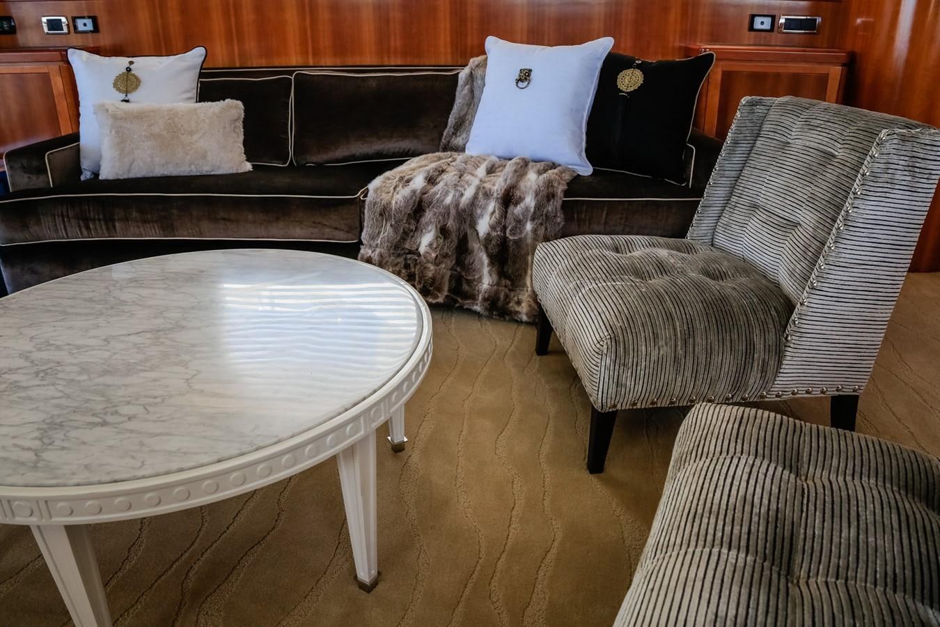 a cat sitting on a couch aboard HUNTER Yacht for Sale