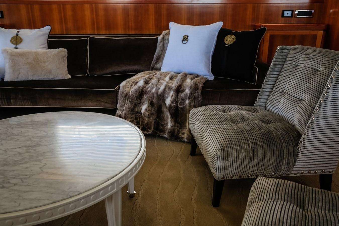 a cat sitting on a couch aboard HUNTER Yacht for Sale
