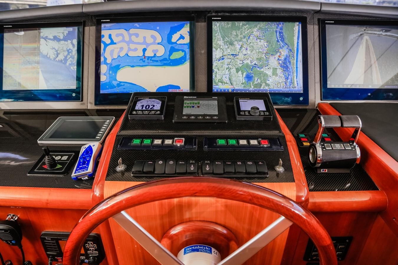 a group of electronic devices on a table aboard HUNTER Yacht for Sale
