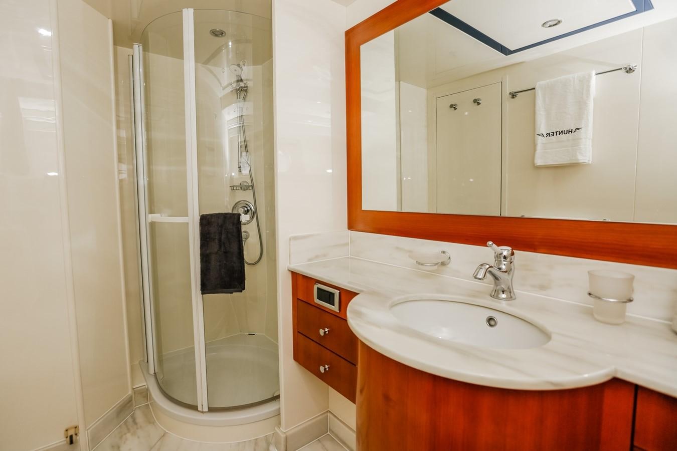 a bathroom with a shower unit and sink aboard HUNTER Yacht for Sale