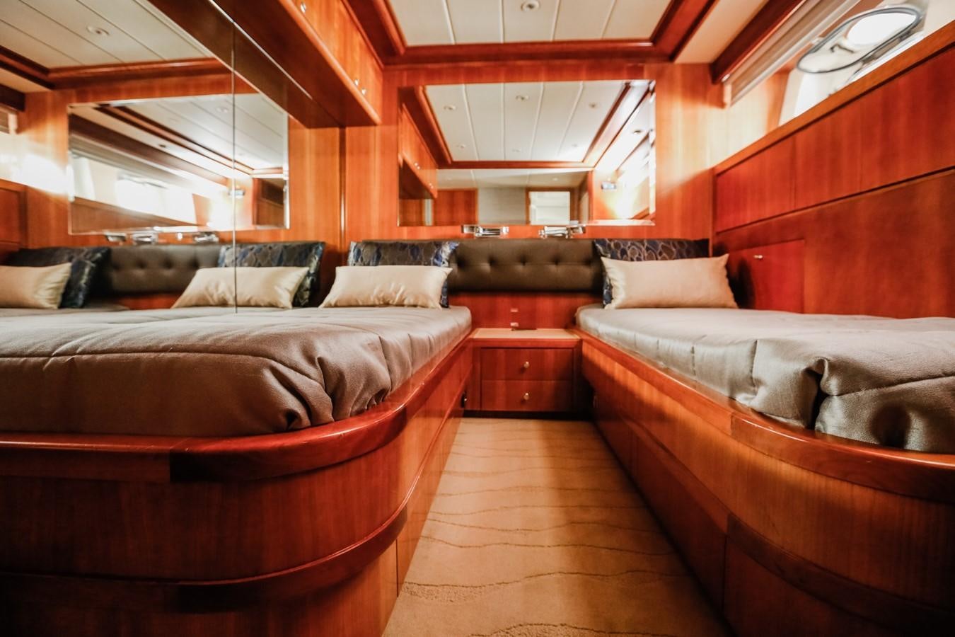 a room with a bed and a couch aboard HUNTER Yacht for Sale