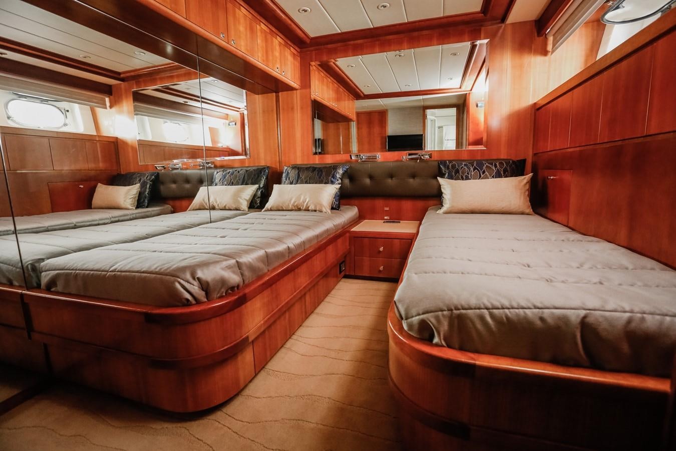 a room with beds and a couch aboard HUNTER Yacht for Sale