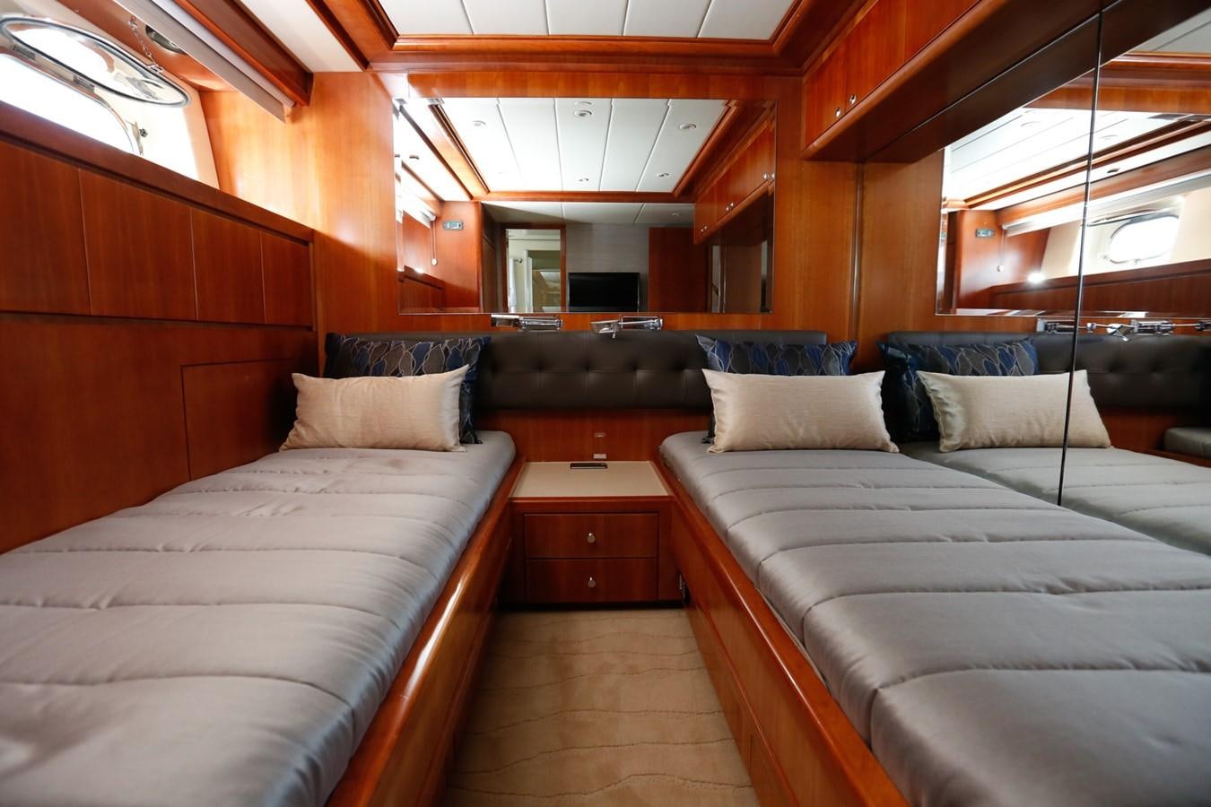 a room with a bed and a couch aboard HUNTER Yacht for Sale