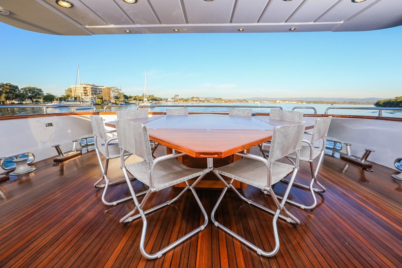 a table and chairs on a deck aboard HUNTER Yacht for Sale