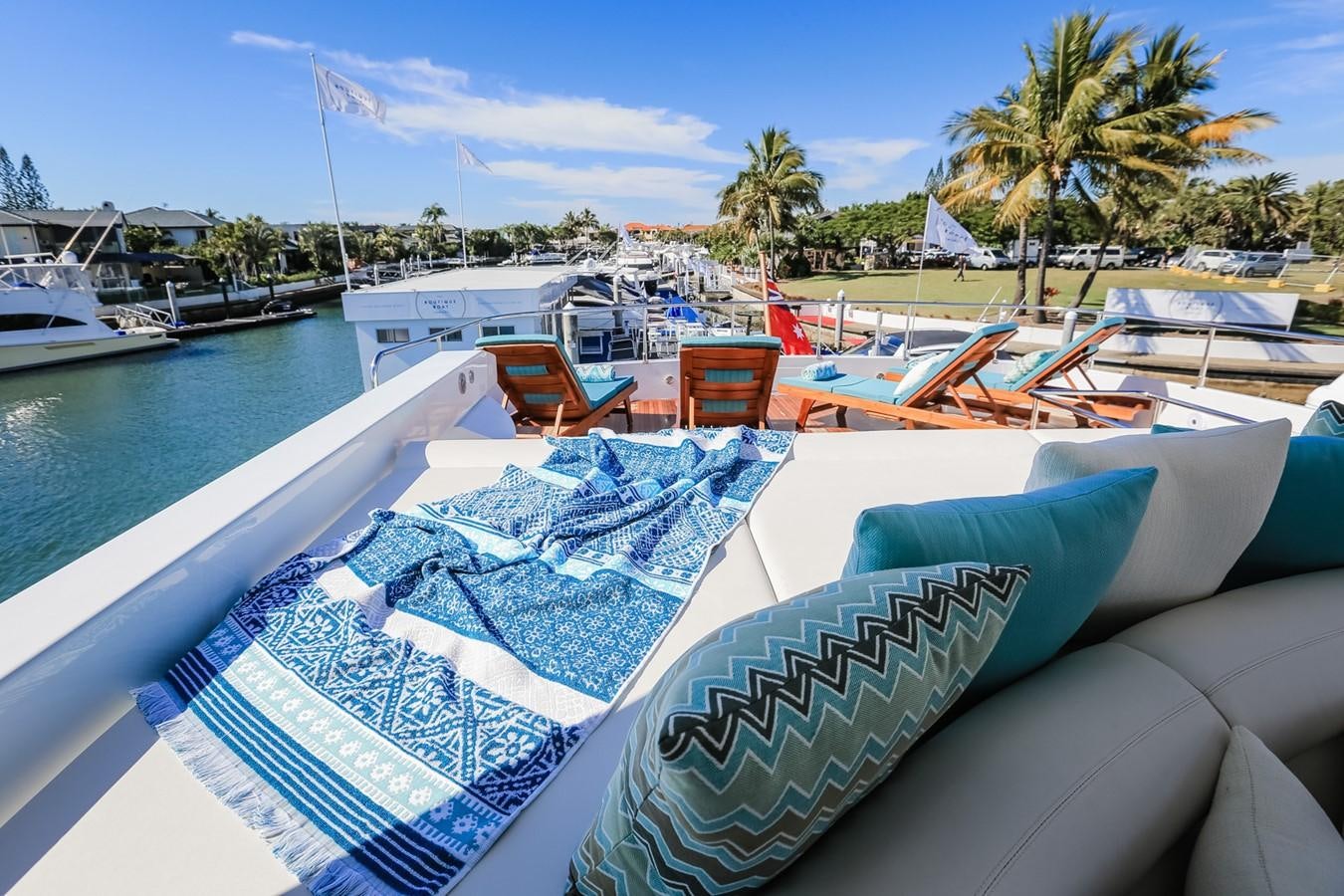 a pool with lounge chairs and umbrellas on it aboard HUNTER Yacht for Sale