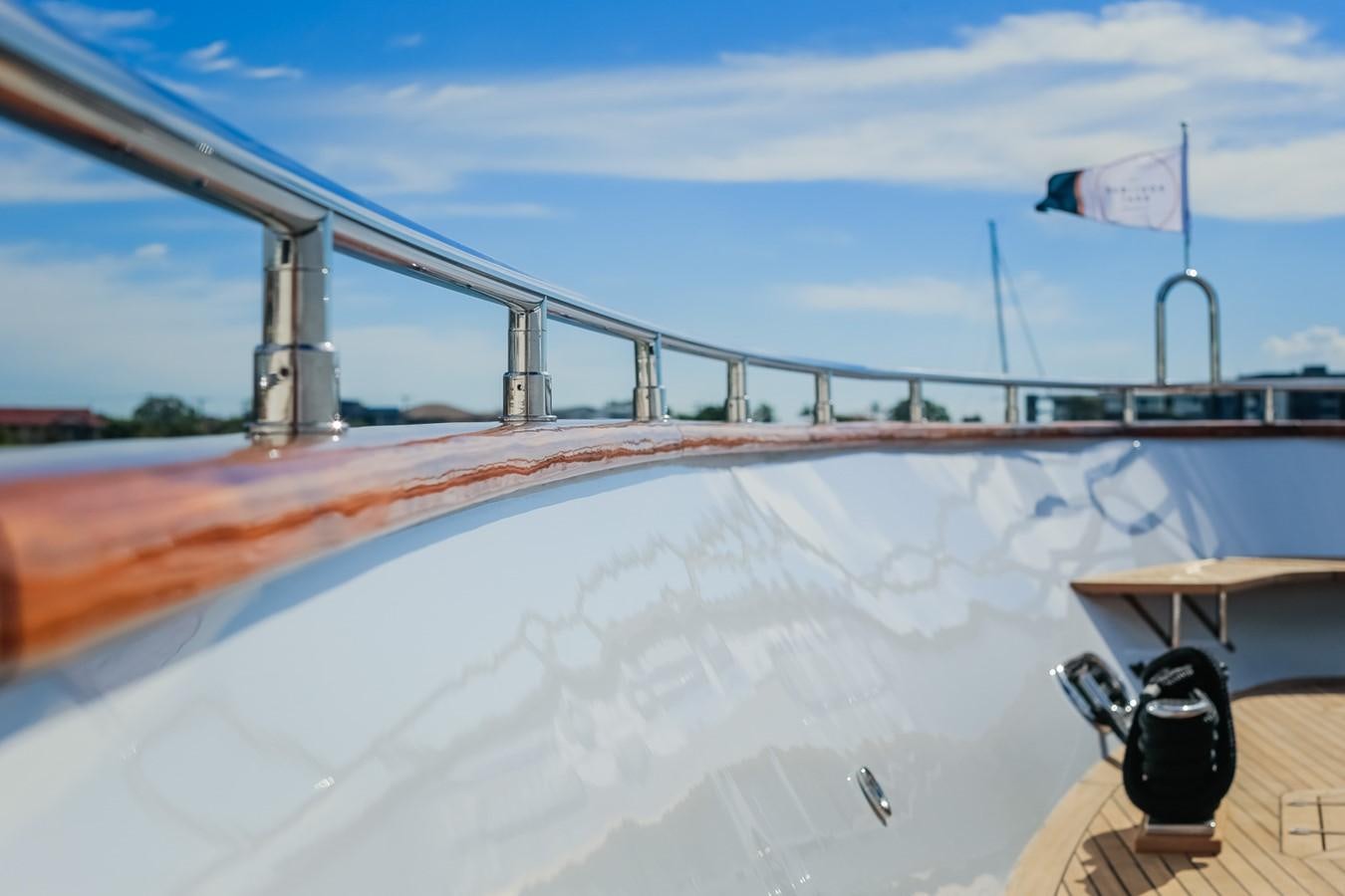 a large white ship with a red and white sail aboard HUNTER Yacht for Sale