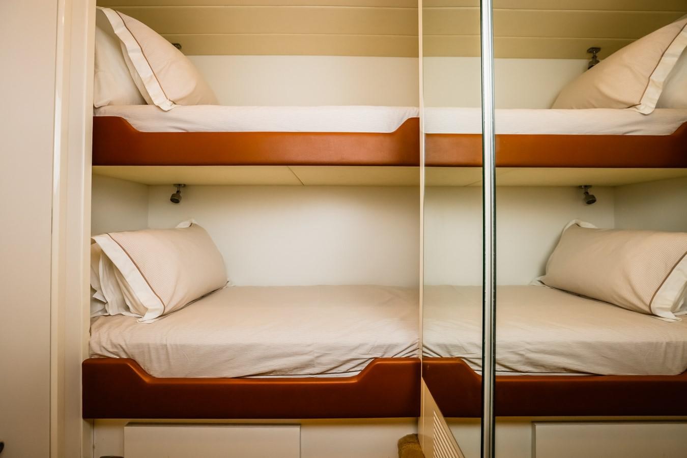 a bed with white sheets aboard HUNTER Yacht for Sale