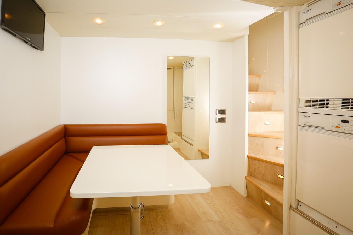 a living room with a couch and a table aboard HUNTER Yacht for Sale