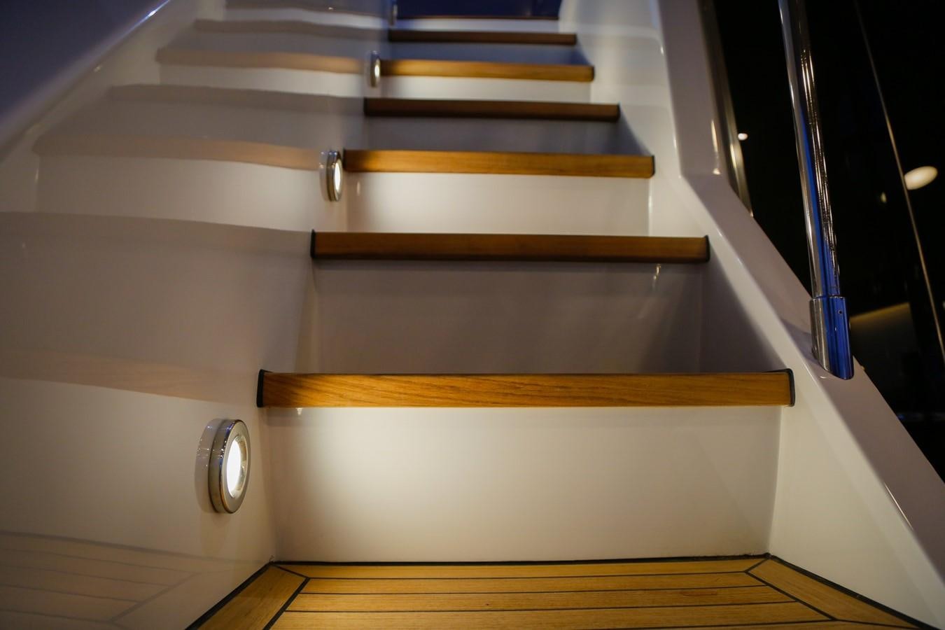 a wooden shelf with a silver knob aboard HUNTER Yacht for Sale