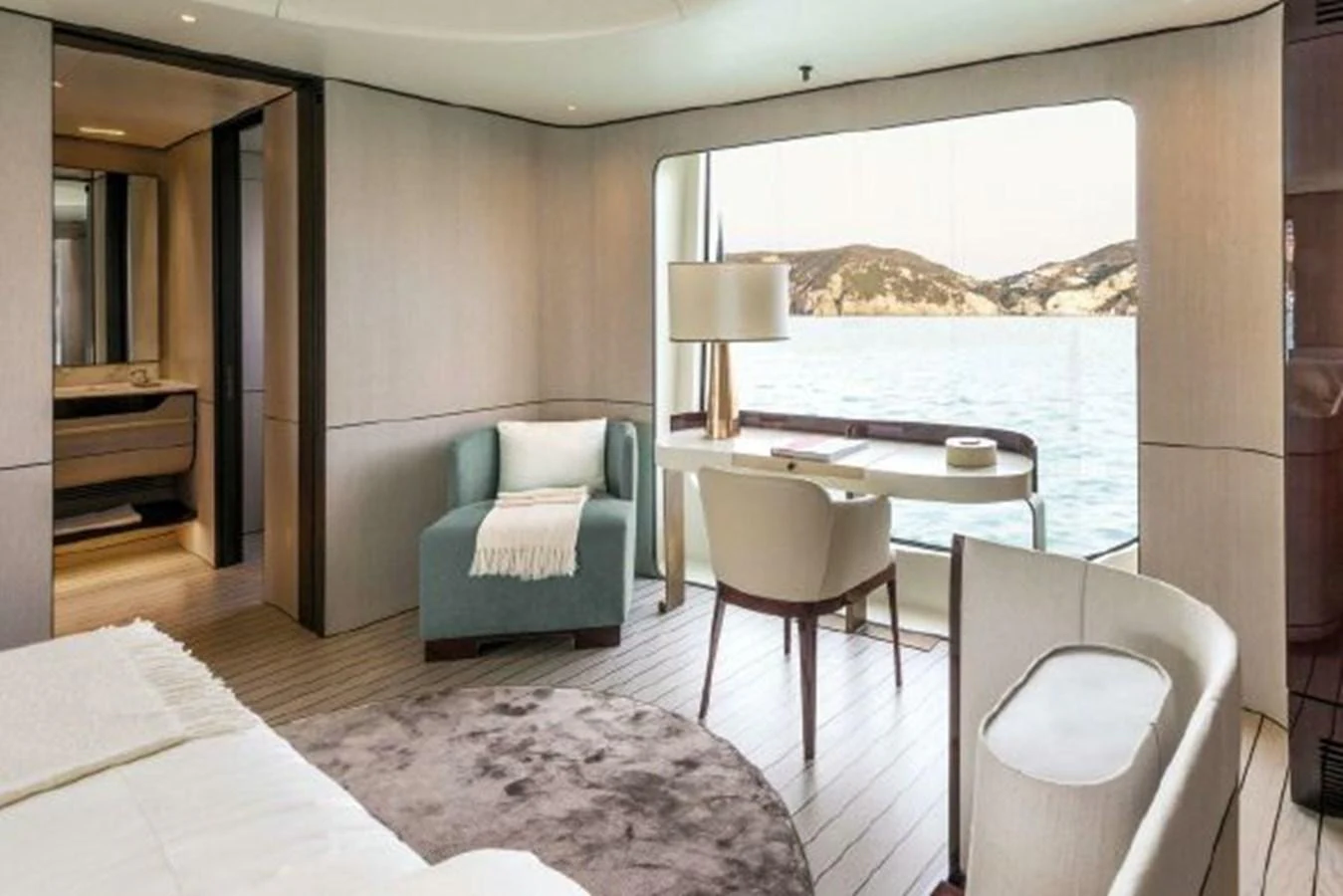 a room with a bed and a table and chairs aboard 2019 AZIMUT GRANDE 35 METRI Yacht for Sale