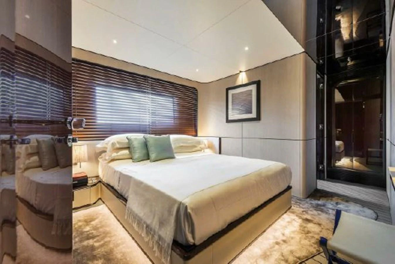 a bedroom with a bed and a chair aboard 2019 AZIMUT GRANDE 35 METRI Yacht for Sale
