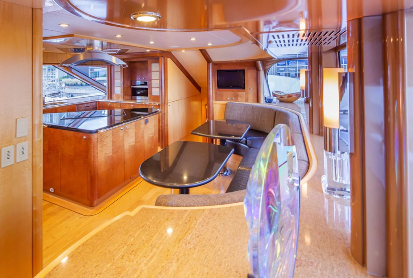 a room with a table and chairs aboard C JEWEL Yacht for Sale