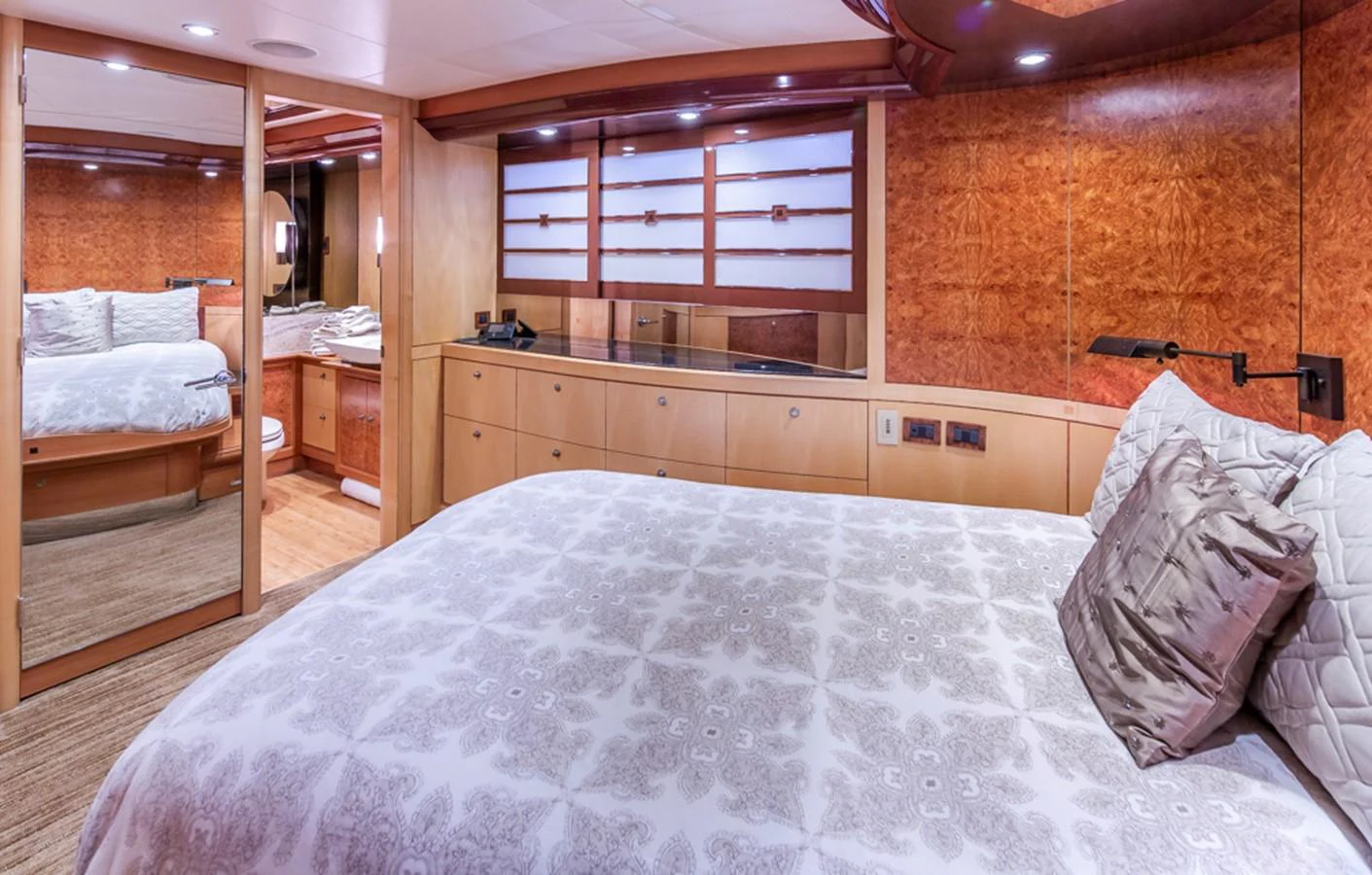 a bedroom with a bed and a desk aboard C JEWEL Yacht for Sale