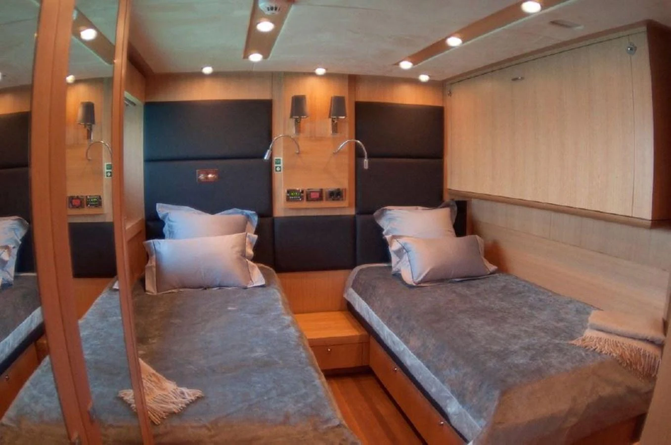 a room with a bed and a bunk bed aboard SUN FLOWER Yacht for Sale
