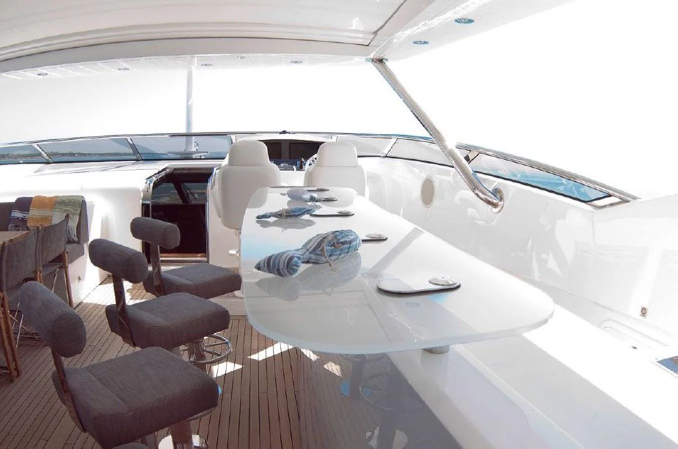 a room with a table and chairs aboard SUN FLOWER Yacht for Sale