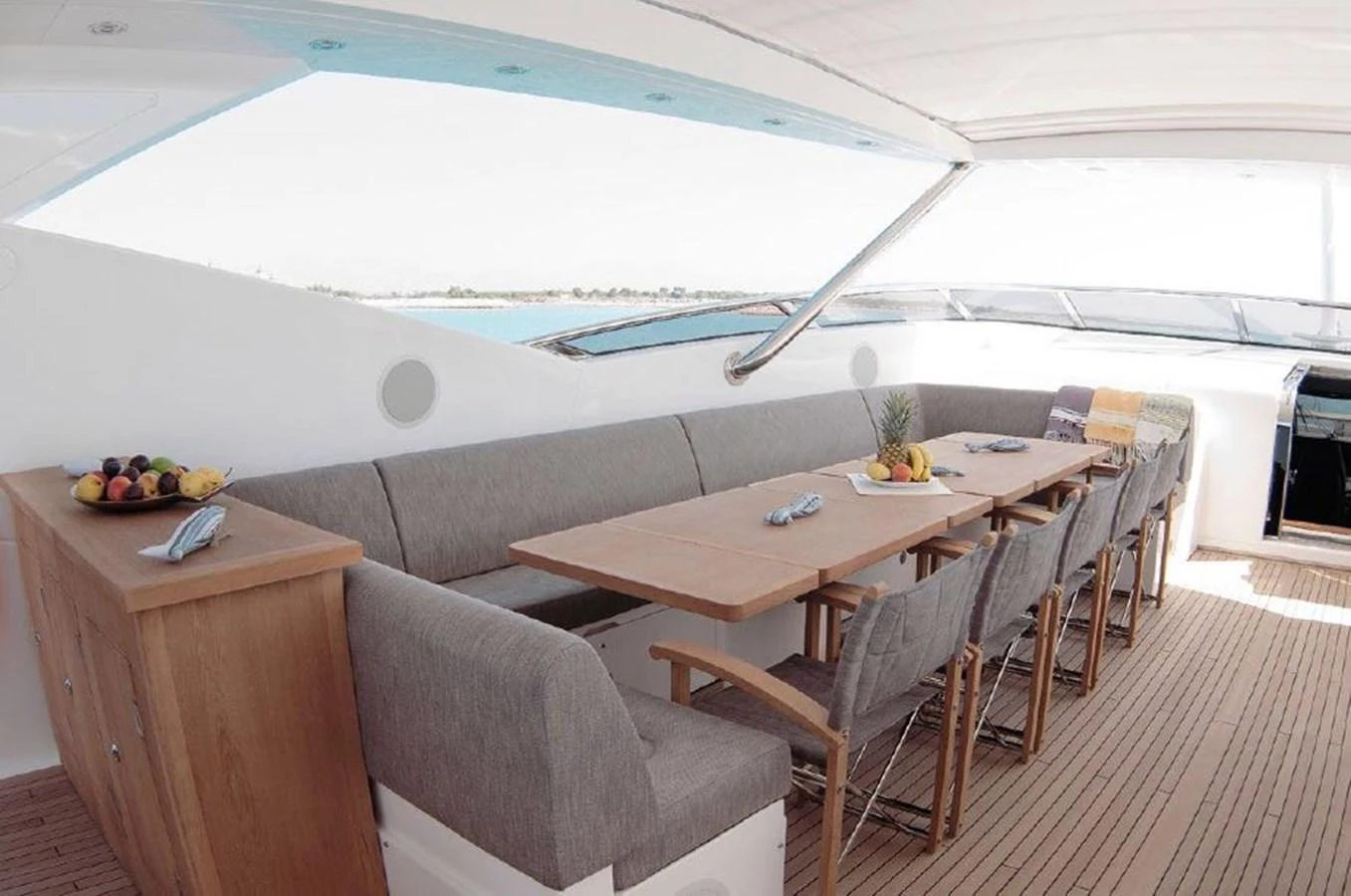 a tent with a table and chairs aboard SUN FLOWER Yacht for Sale