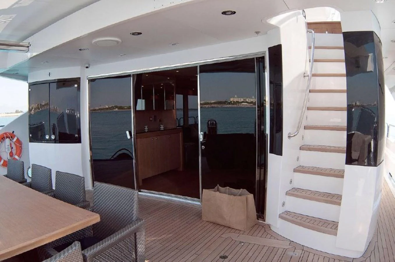 a room with a table and chairs aboard SUN FLOWER Yacht for Sale