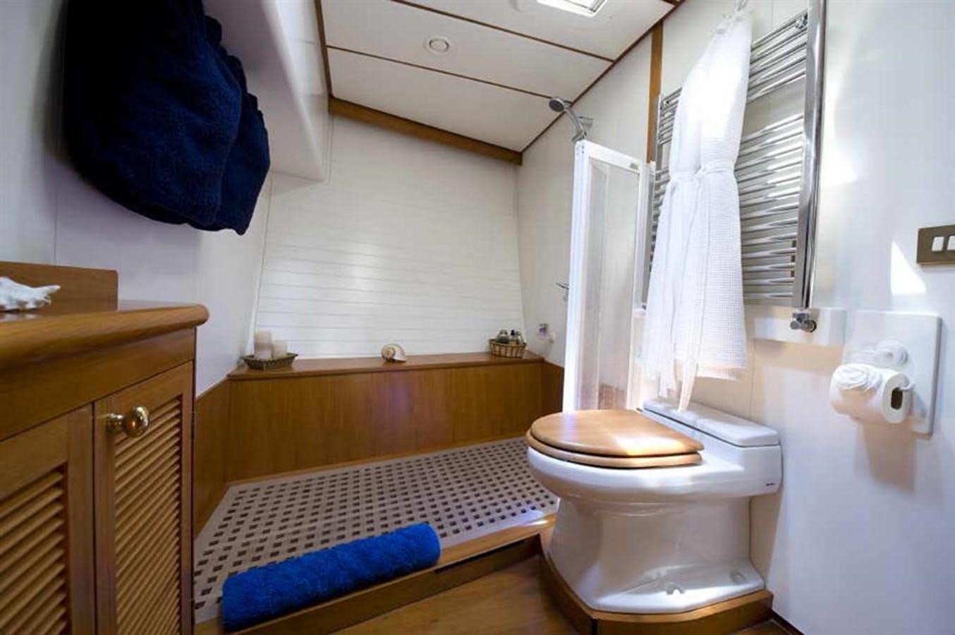 a bathroom with a toilet and a sink aboard BAIURDO VI Yacht for Sale