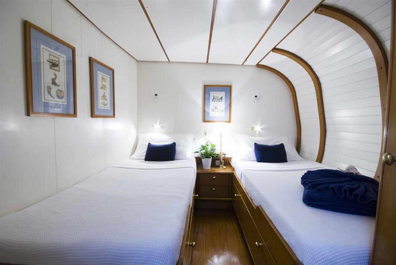 a couple of beds in a room aboard BAIURDO VI Yacht for Sale