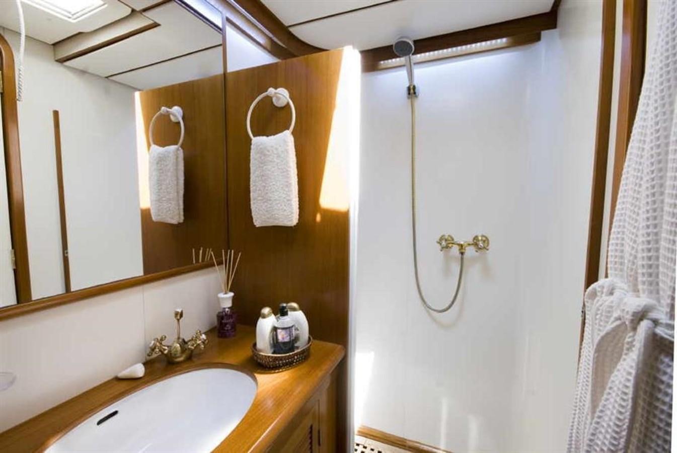 a bathroom with a shower curtain aboard BAIURDO VI Yacht for Sale