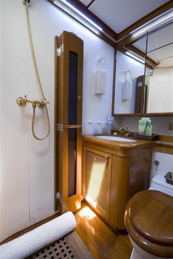 a bathroom with a sink and toilet aboard BAIURDO VI Yacht for Sale