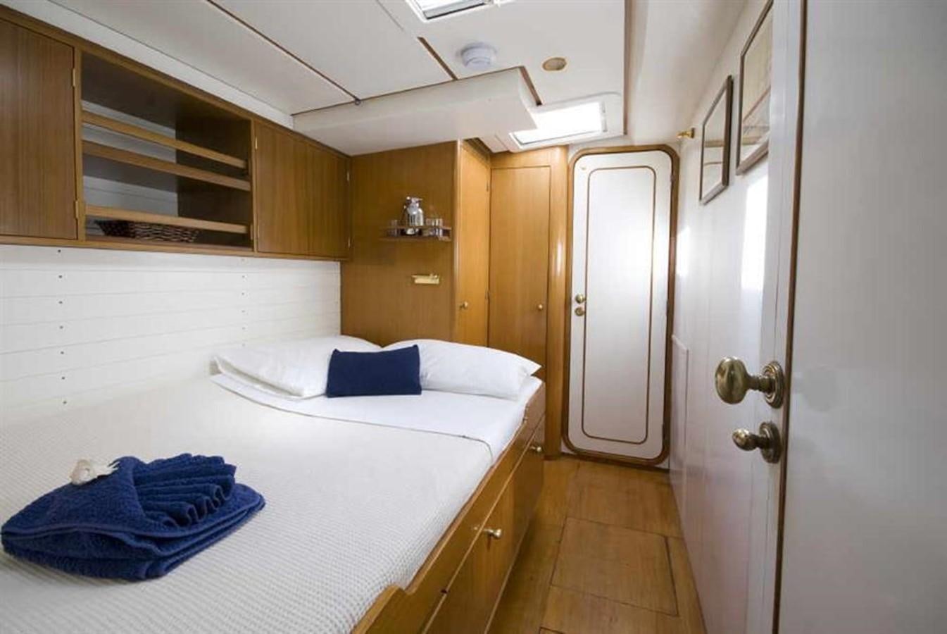 a room with a bed and a closet aboard BAIURDO VI Yacht for Sale