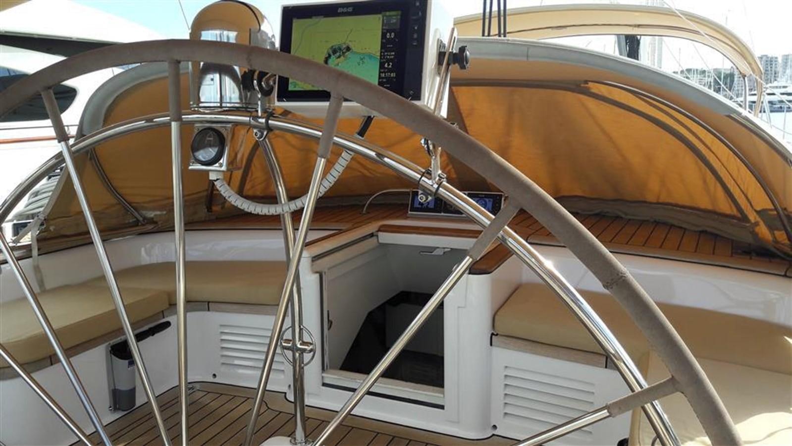 a close-up of a wooden wheel aboard BAIURDO VI Yacht for Sale