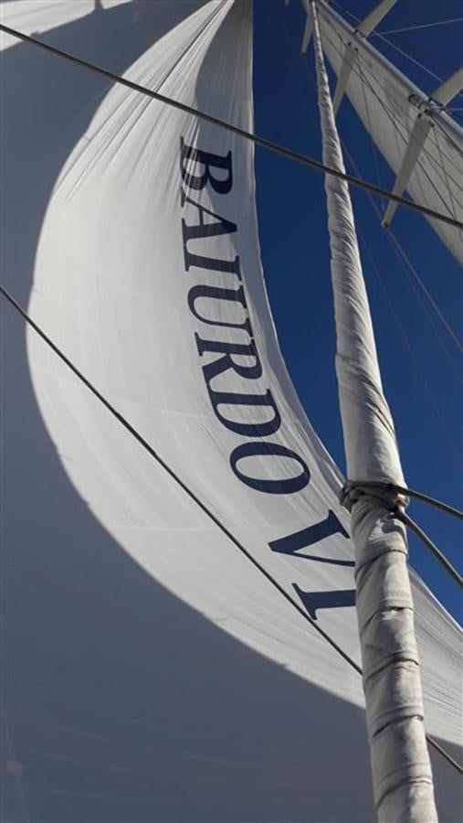 a sailboat with a face aboard BAIURDO VI Yacht for Sale
